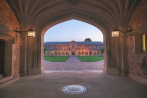 Photo shot through gothic stone archway on WashU's Danforth Campus