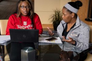 De’Ona Hardy, of Collinsville, Ill., and Erica Jenkins, of Madison, Ill., are set to graduate with associate’s degrees from Washington University in May. Both are certified medical assistants at the School of Medicine and students in the pre-nursing program at University College. The two friends frequently meet after work to study for anatomy and physiology exams.