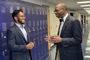 Hamza Jalal (left), a first-year student at Washington University School of Medicine in St. Louis, tours the Collegiate School of Medicine and Bioscience in south St. Louis with his mentor and the high school’s co-founder, Will Ross, MD, the medical school’s associate dean for diversity.