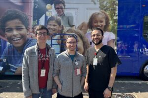 Dispensing health-care advice and offering information about community resources at the Greater St. Louis Hispanic Festival were (from left) Tucker Hansen, Joshua McPhie, and Santiago Blanco Torres, medical students at Washington University School of Medicine in St. Louis.