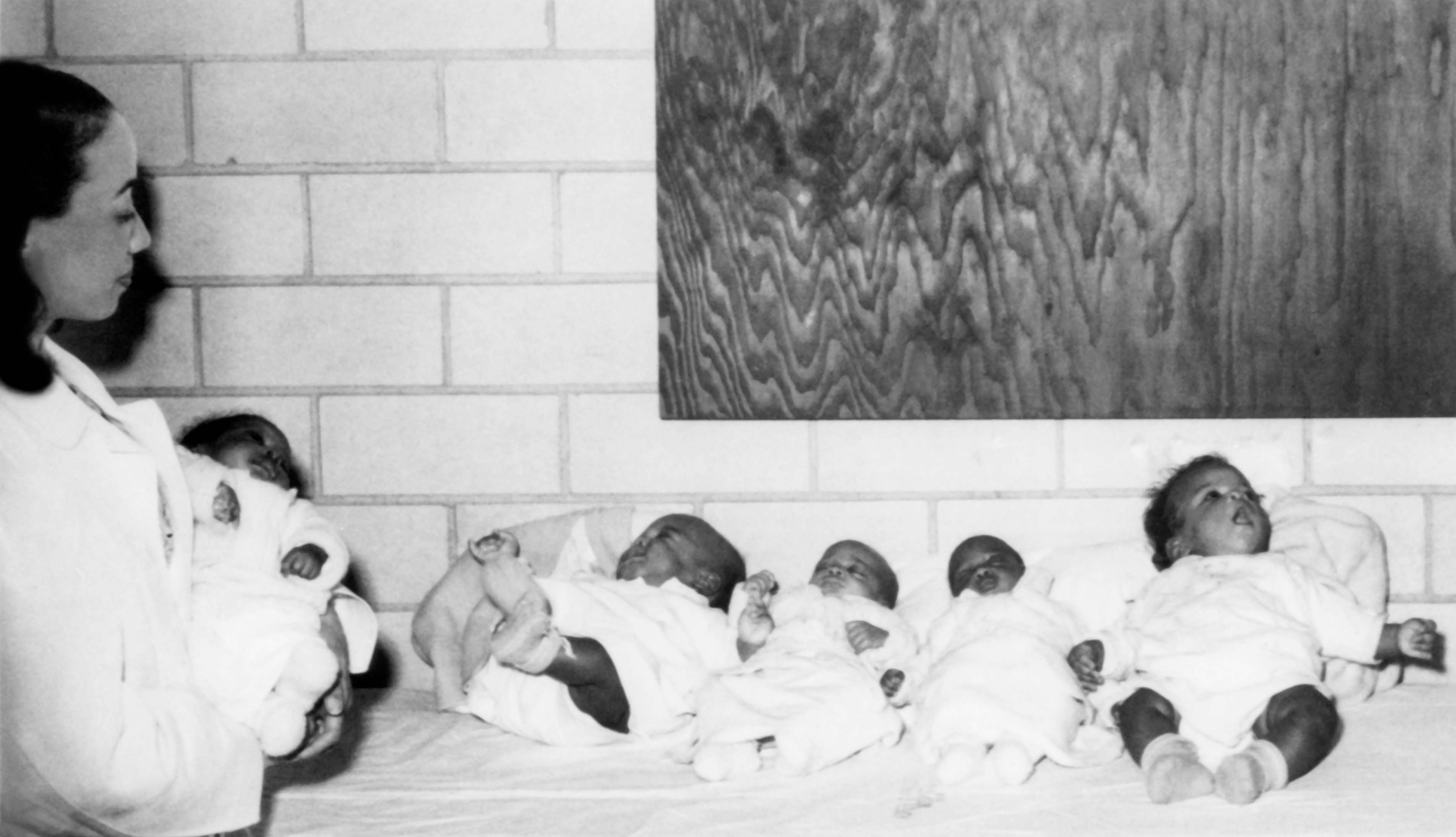 Helen E. Nash, MD, cares for infant patients at Homer G. Phillips Hospital, circa 1945.